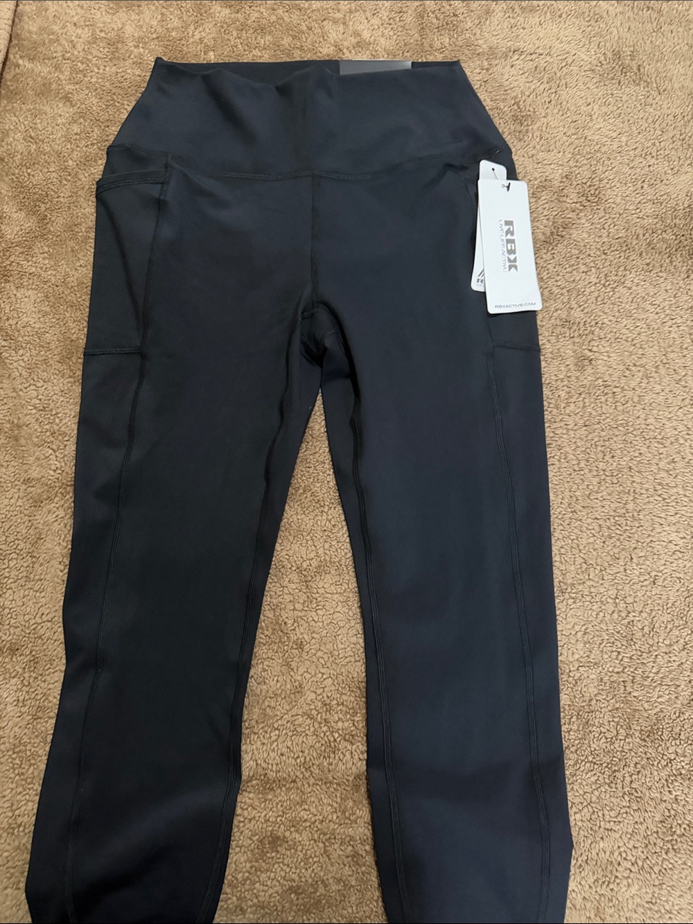RBX Women Black High-Rise Active Leggings with Side Pockets.